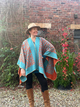 Load image into Gallery viewer, Animal Reversible Poncho (orange and turquoise) - chichappensboutique
